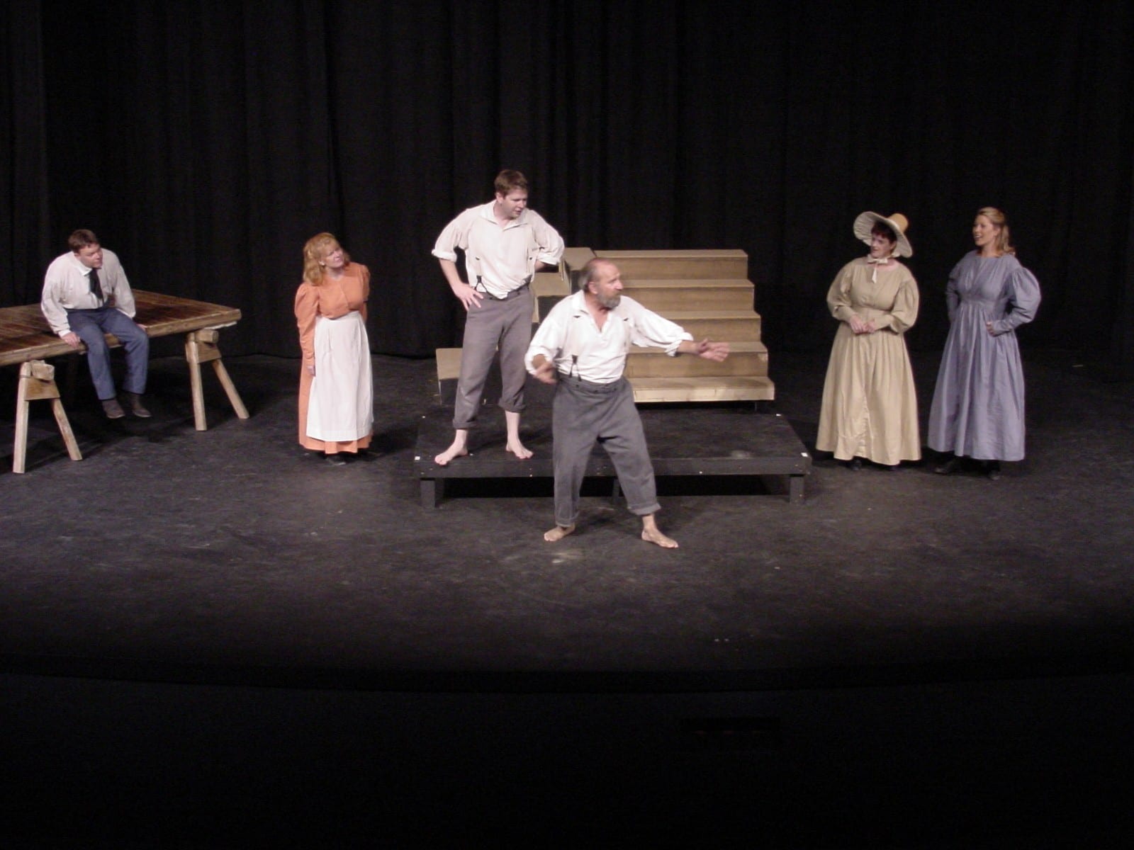 Cast of women in period bonnets