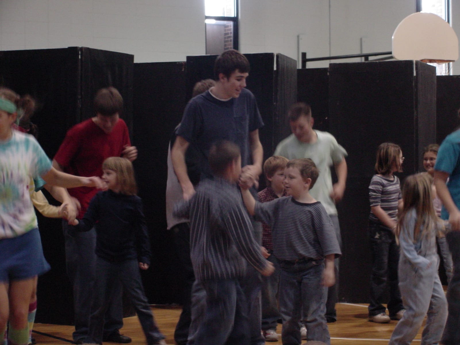 Cast members leading children in an activity