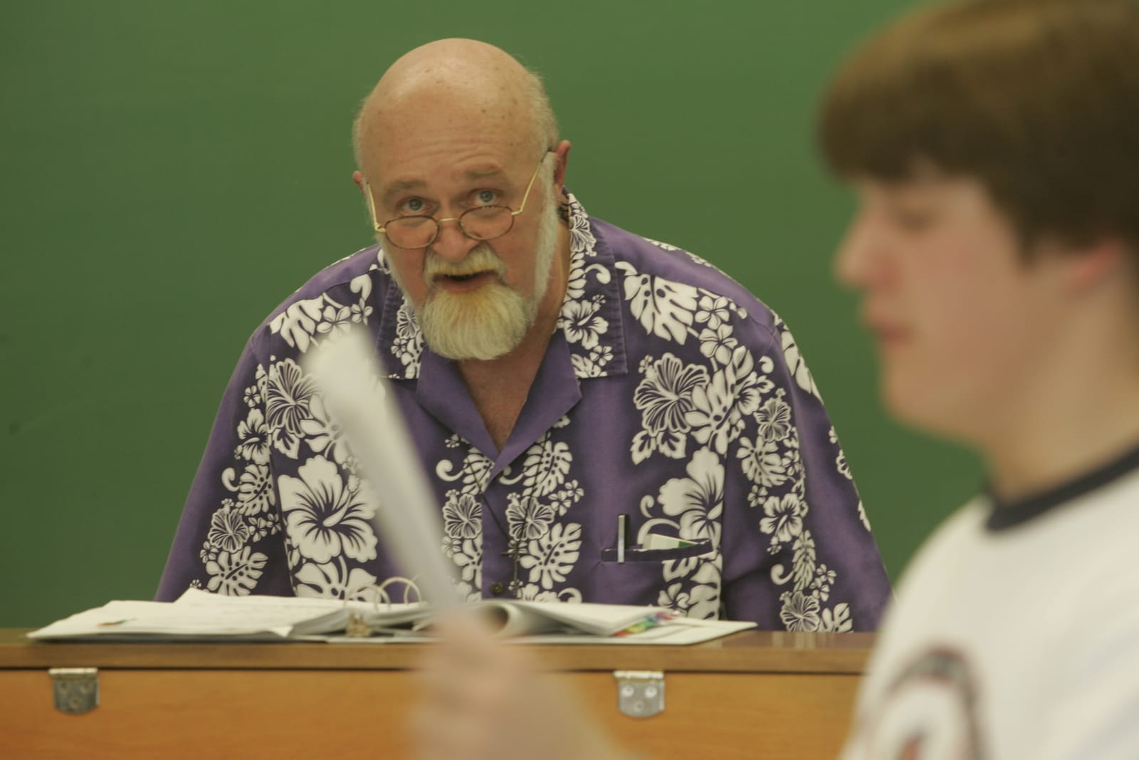 Ken going over a script with a student in class
