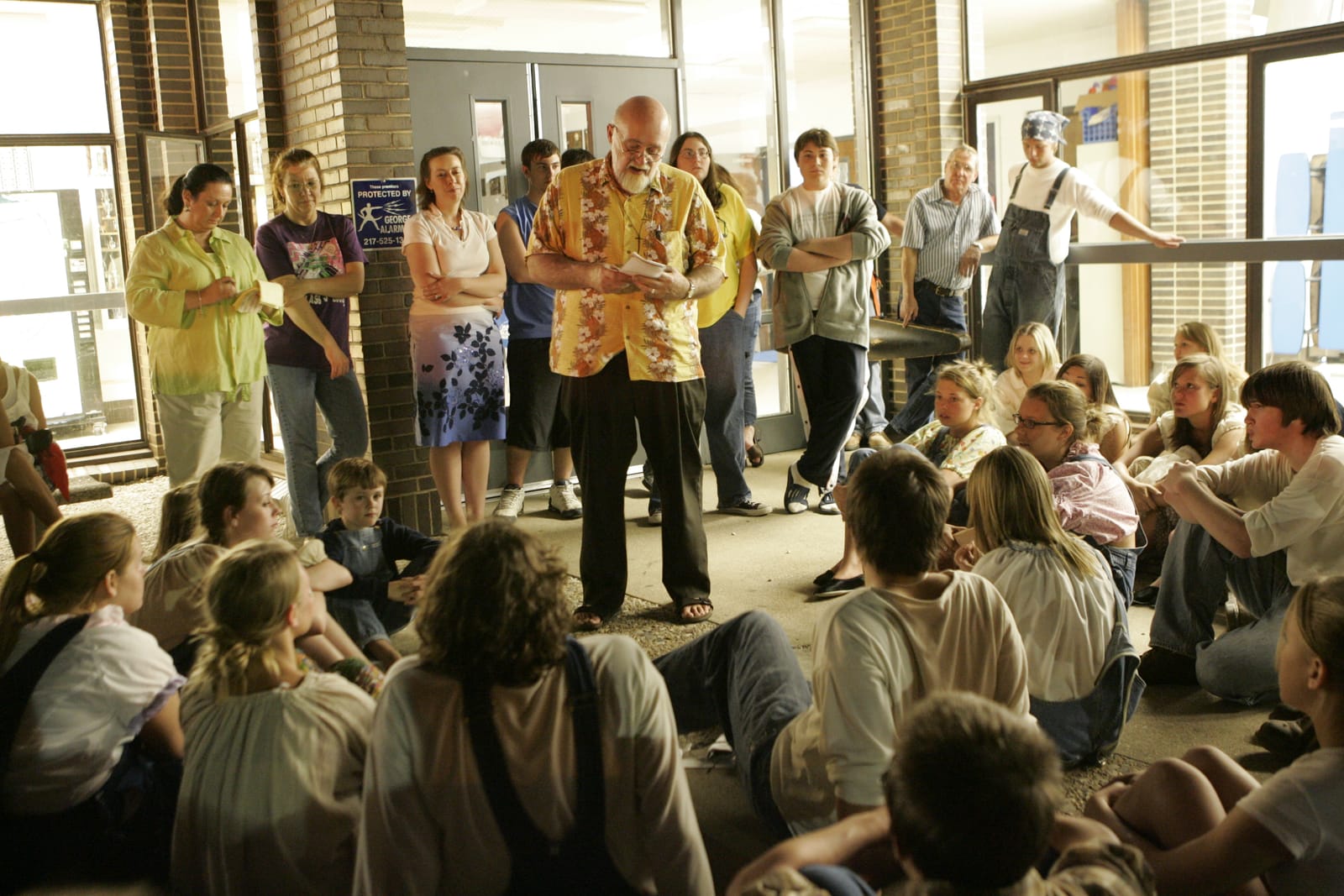 Ken teaching a seated group of students in the round