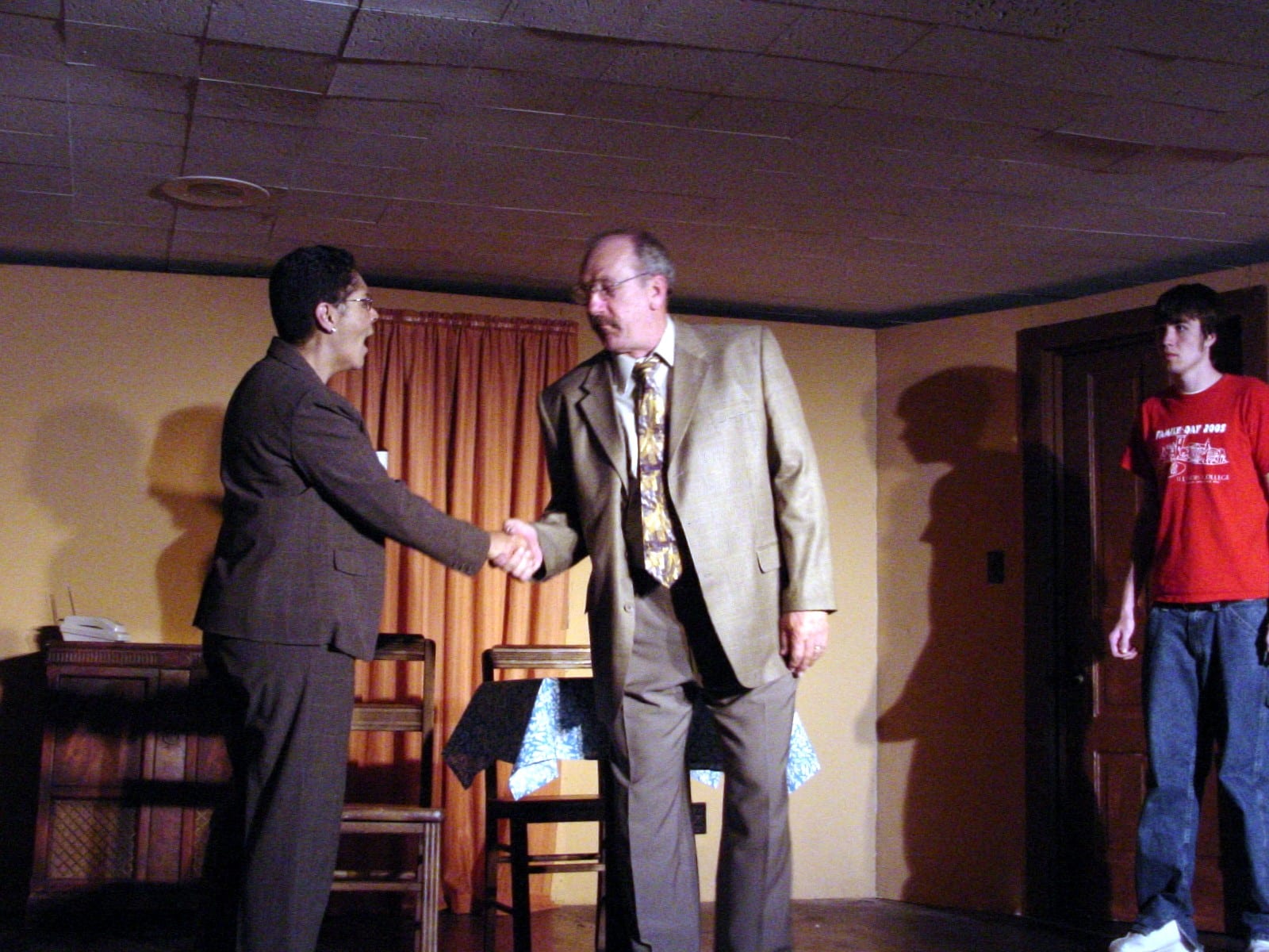 Two performers shaking hands