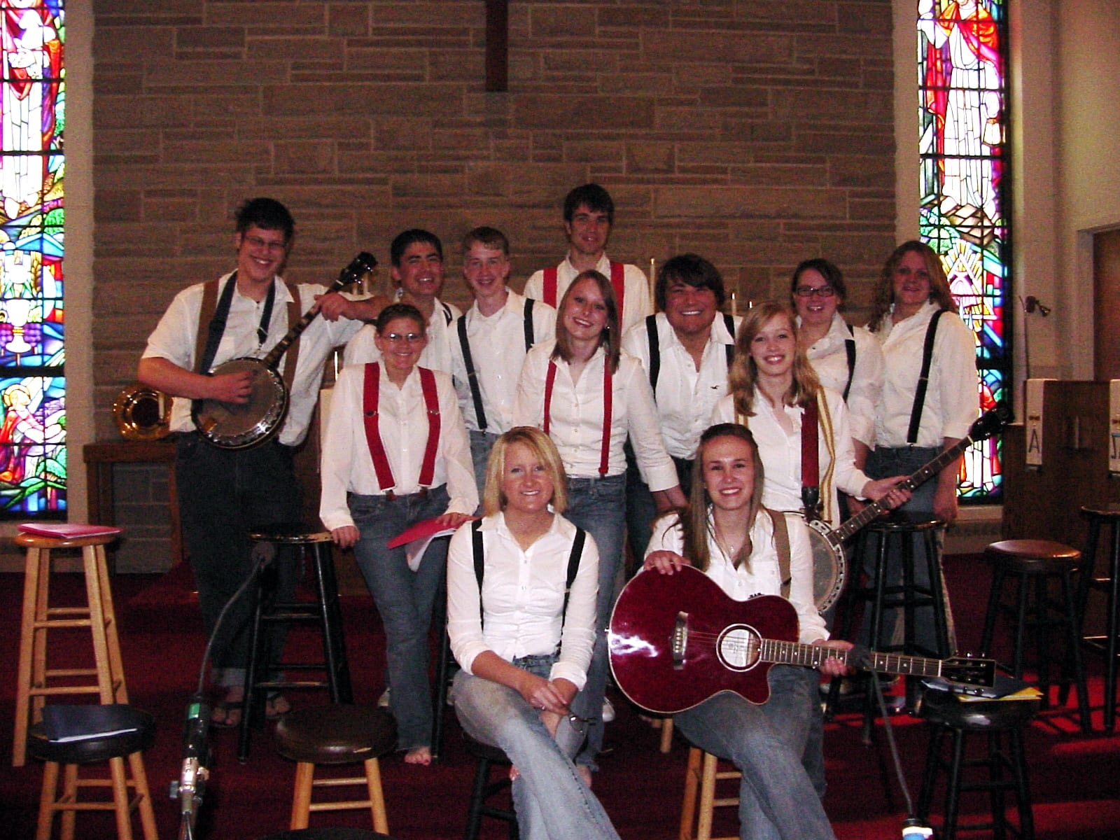 Cast troupe in costume in church