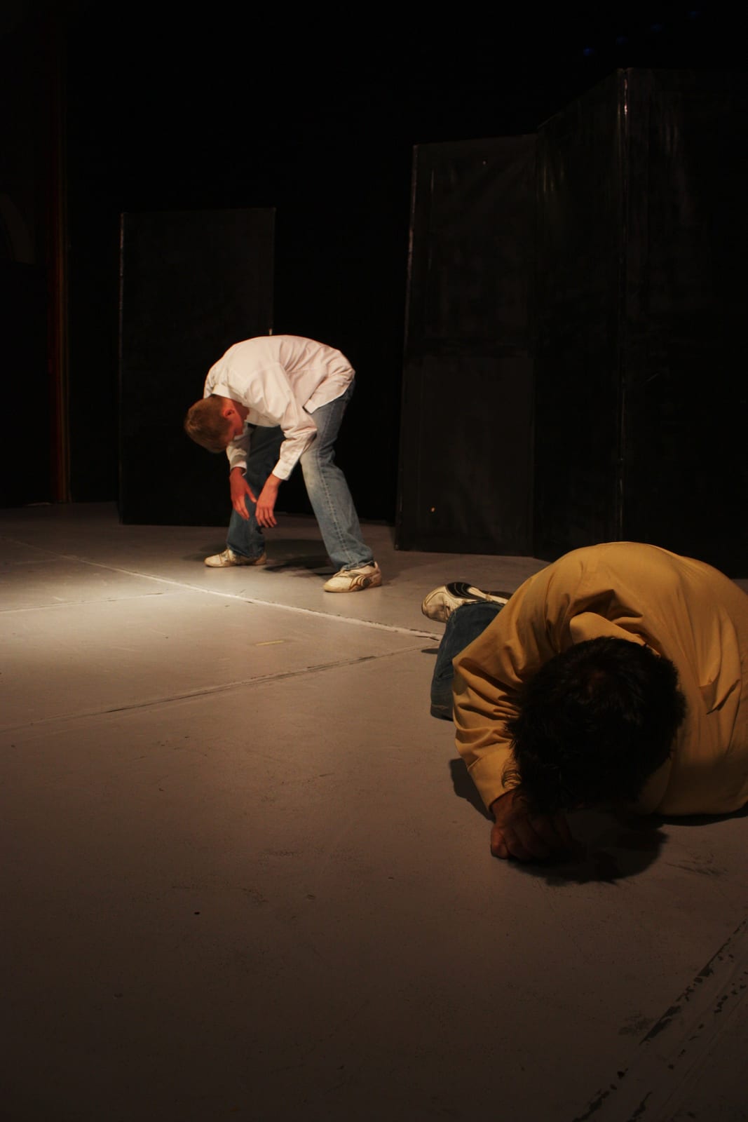 Two performers in a scene on stage