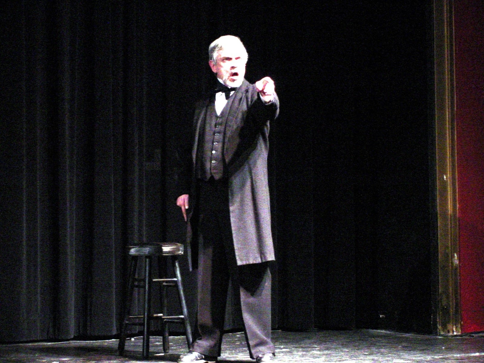 Performer in period costume on stage