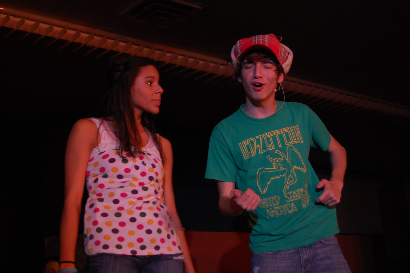 Two cast members on stage