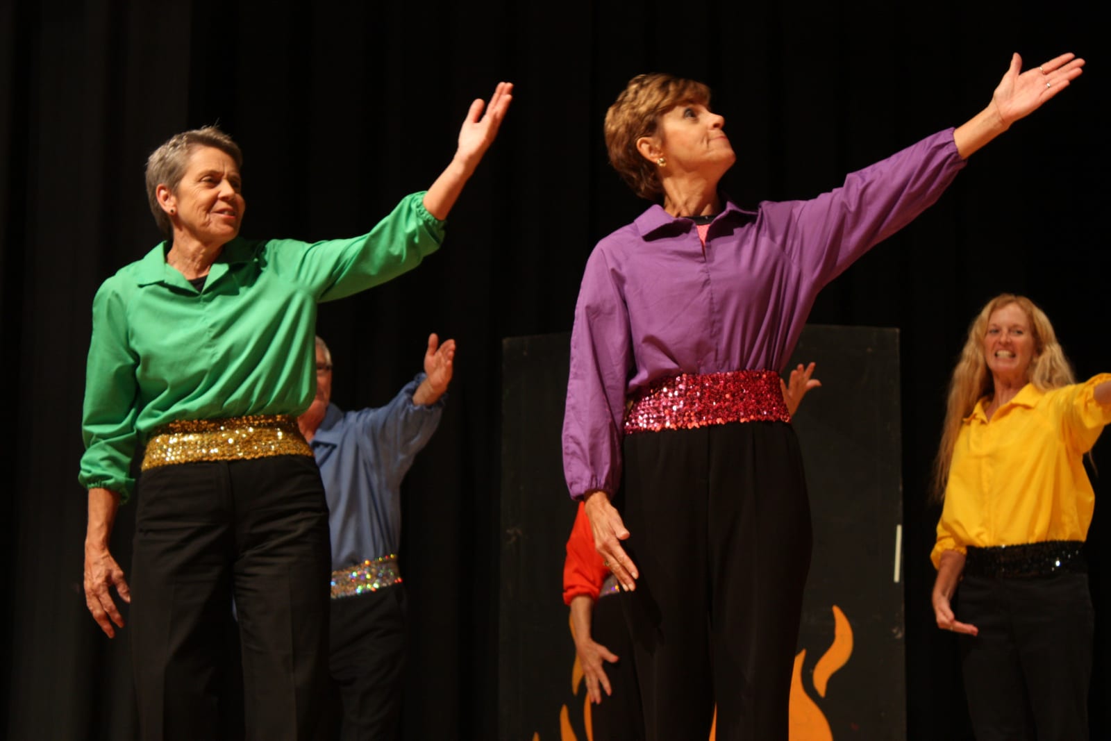 Performer in red costume on stage