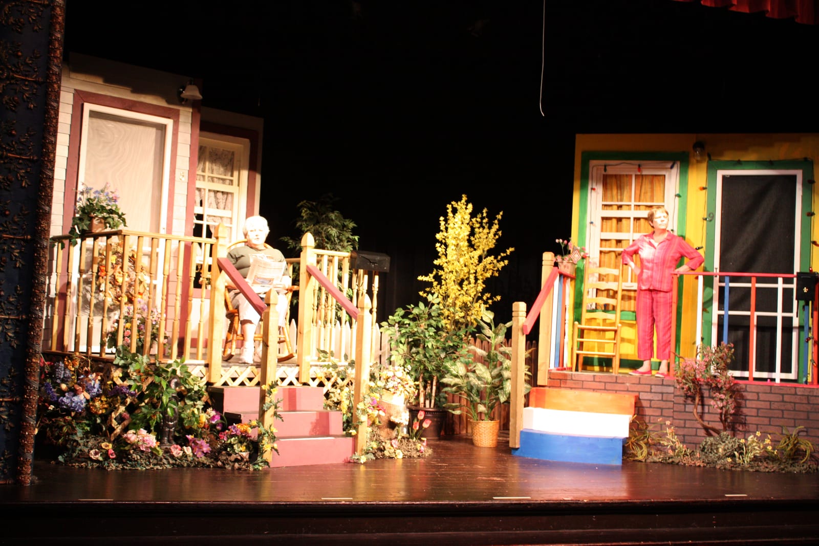 The two friends on their porches across the colorful set