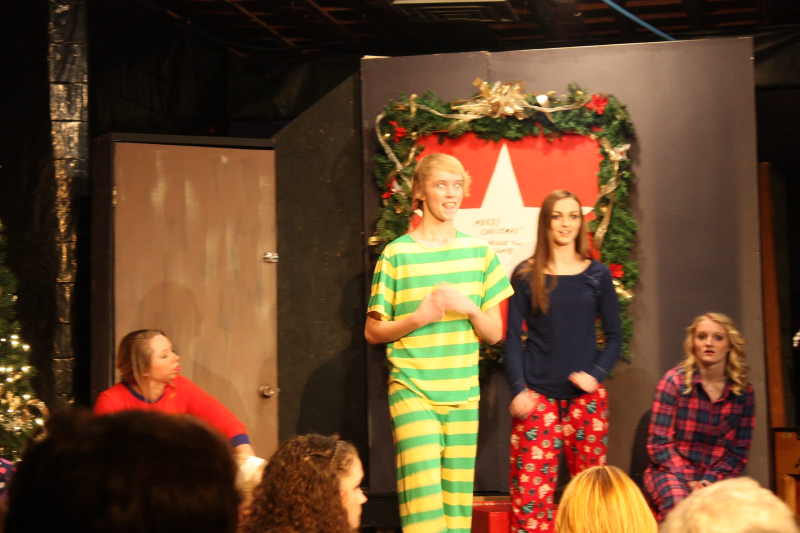 Cast member in striped pajamas performing onstage