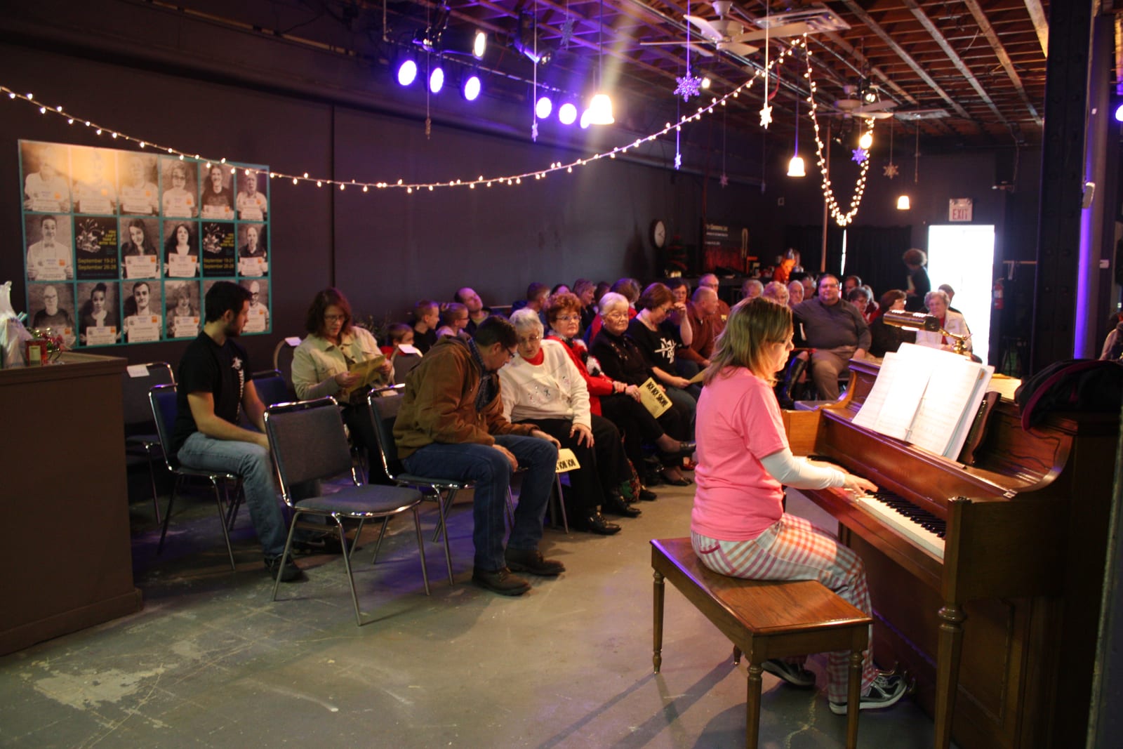 Pianist accompanies the show for the seated audience