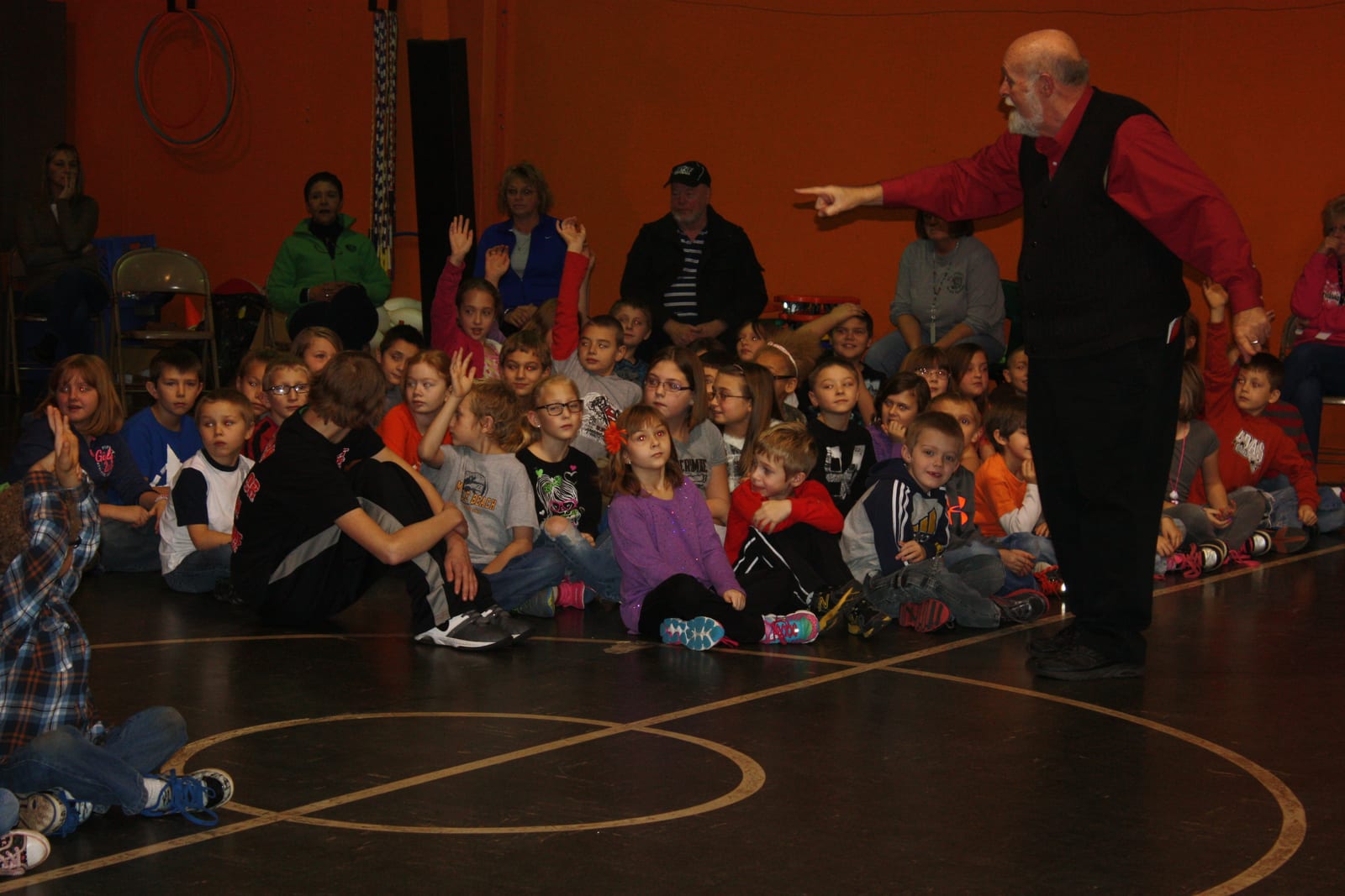 Young audience watching the pirate show in the school gym