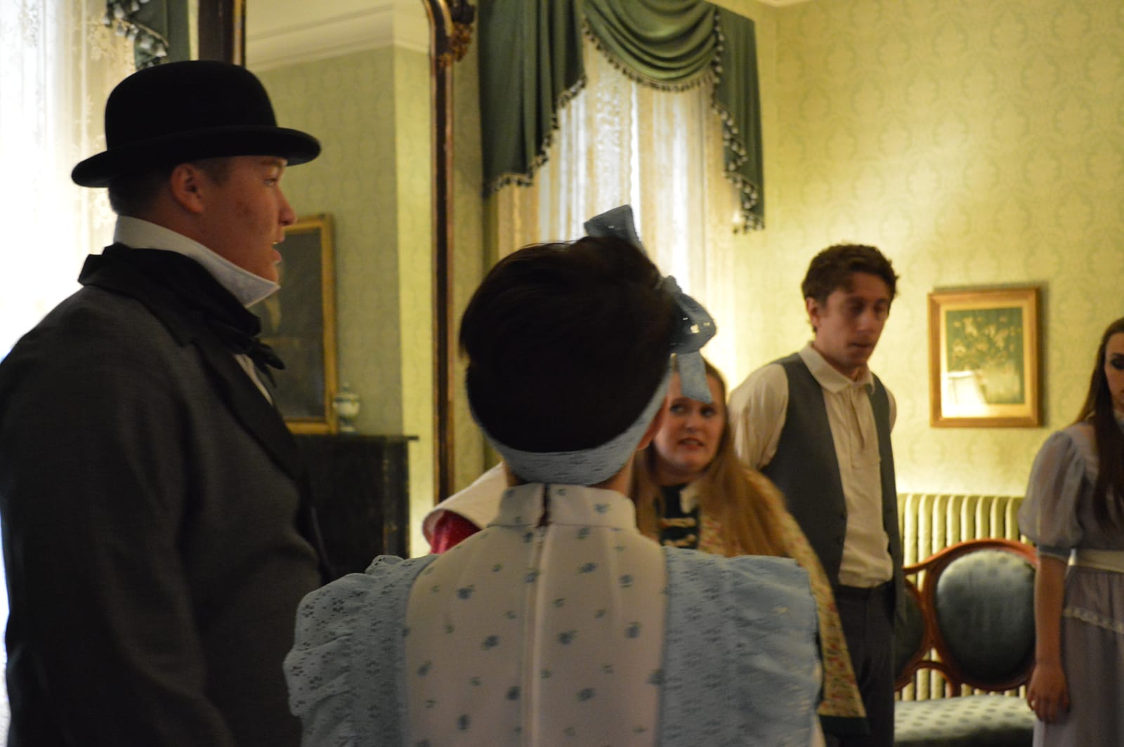 Actors in 1830s dress in the Governor Duncan Mansion parlor