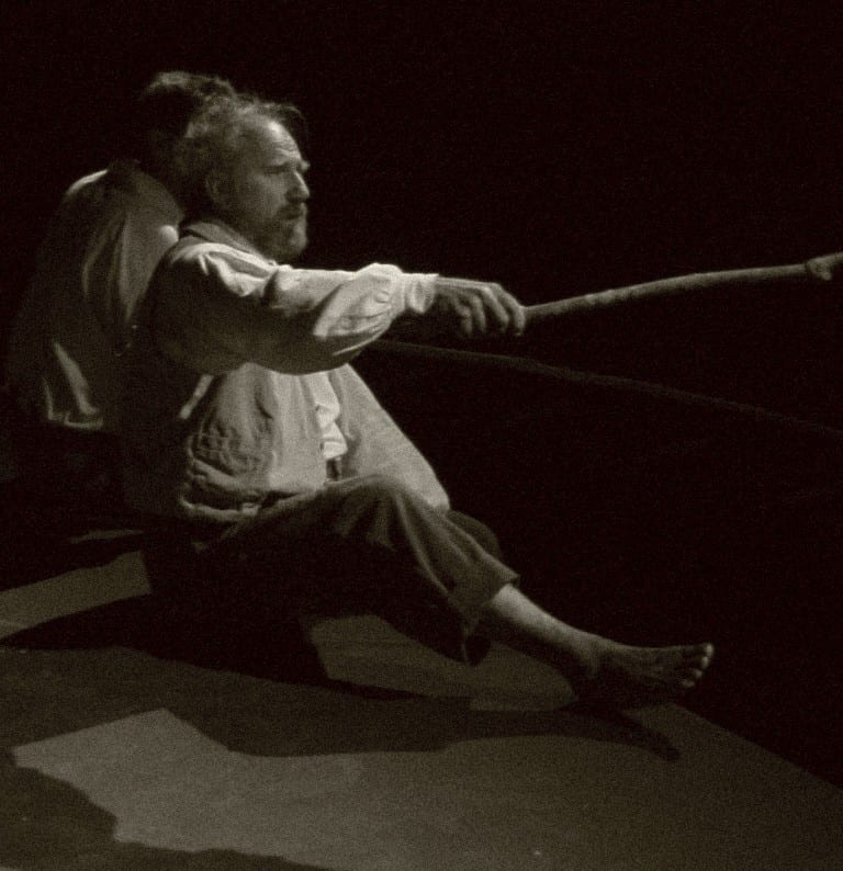 Actor poling the flatboat on the Sangamon