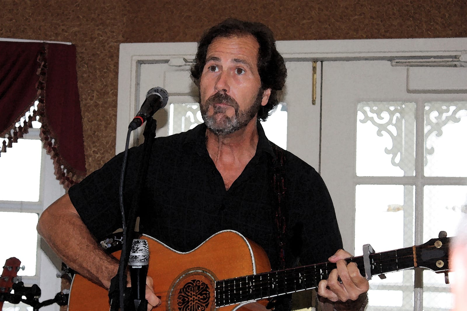 Musician performing with guitar on the boiler deck