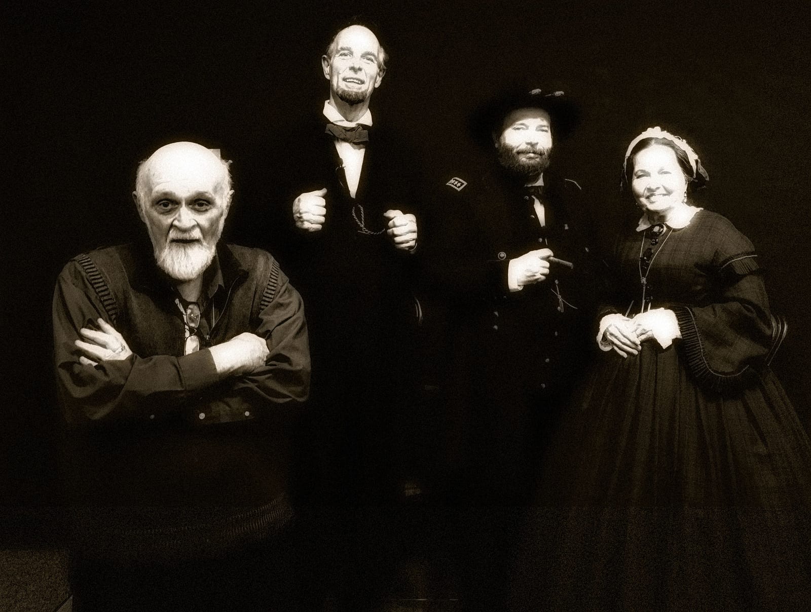 Sepia-toned portrait of the same costumed cast