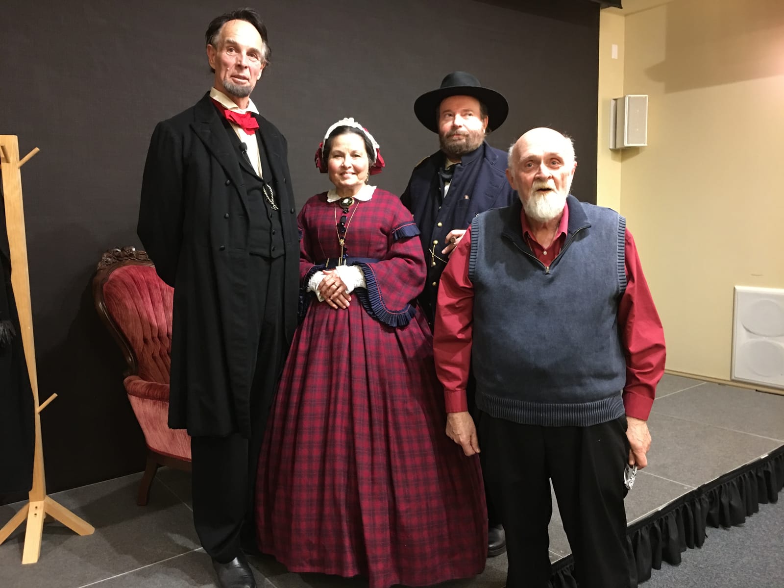 Cast members posed in 19th-century costume